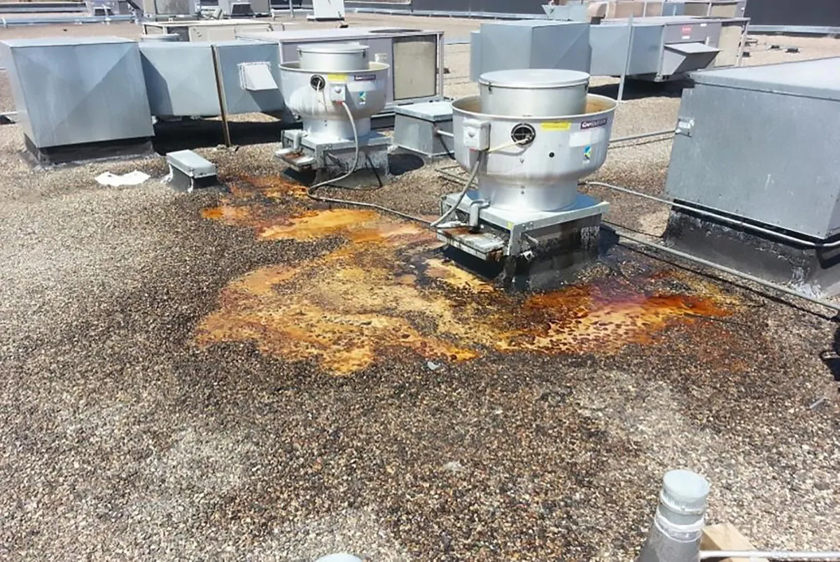 Clean rooftop after grease containment installation
