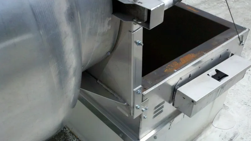 Exhaust fan with hinge kit installed